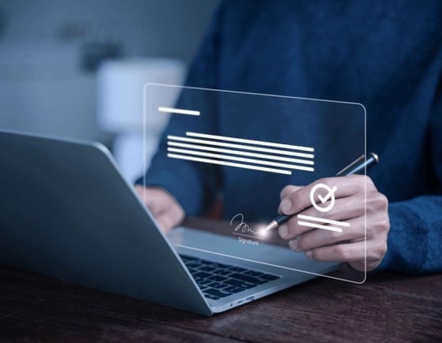 man-signing-digital-document-on
